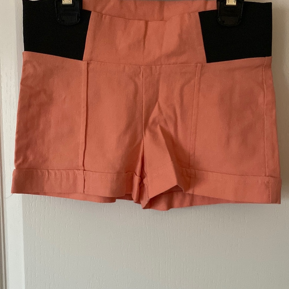 Cute peach color shorts, with stretchable waist more extra comfort.
